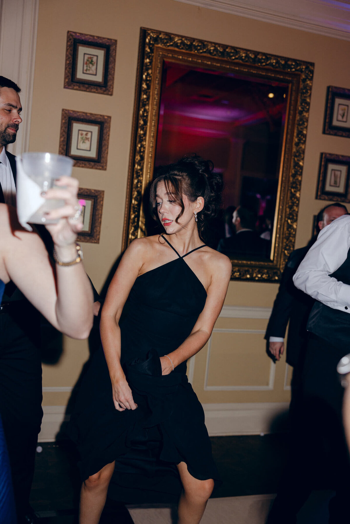 A wedding photo of guests dancing during the wedding reception