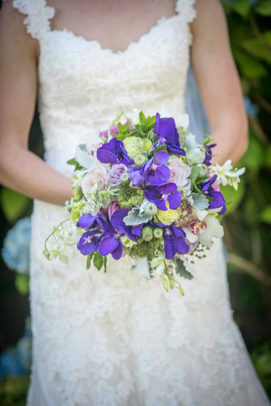 bridal bouquet with purple vanda orchids and greenery