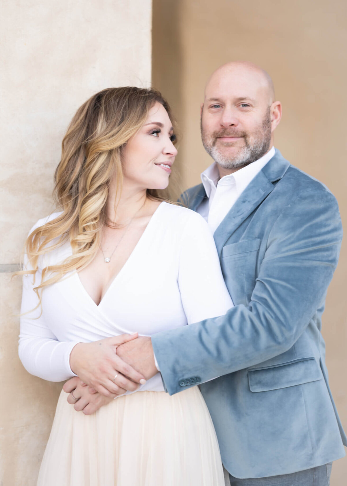 beautiful couple embracing in light and airy portrait
