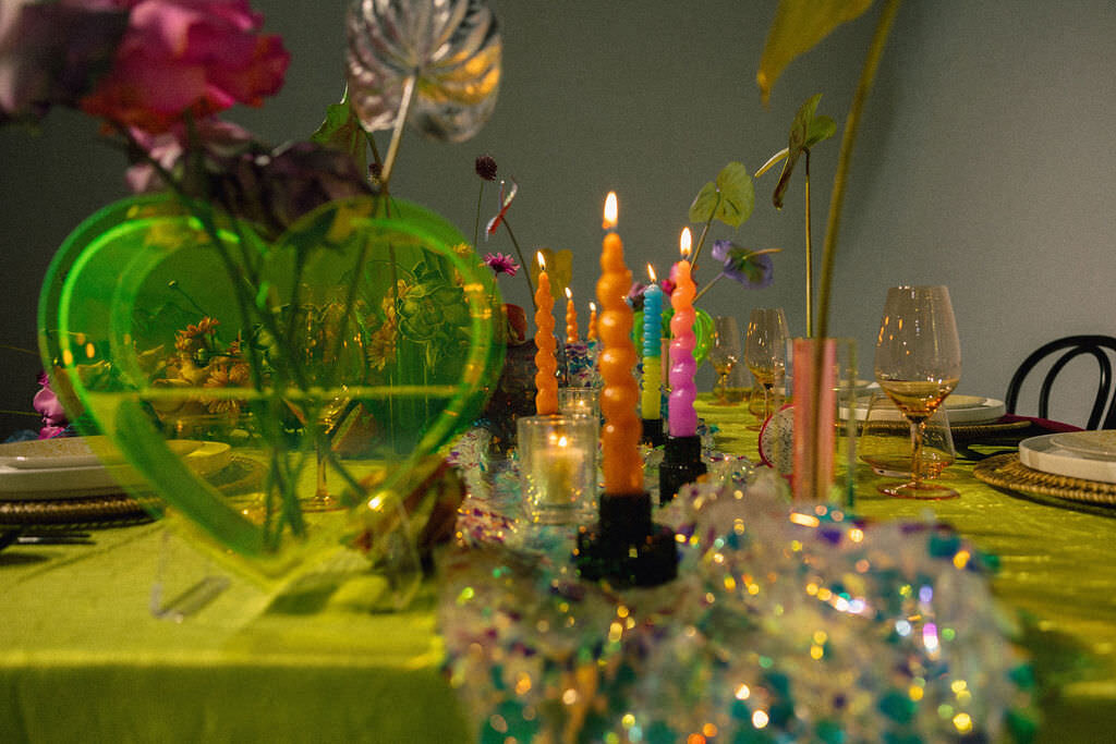 A colorfully decorated wedding reception table.