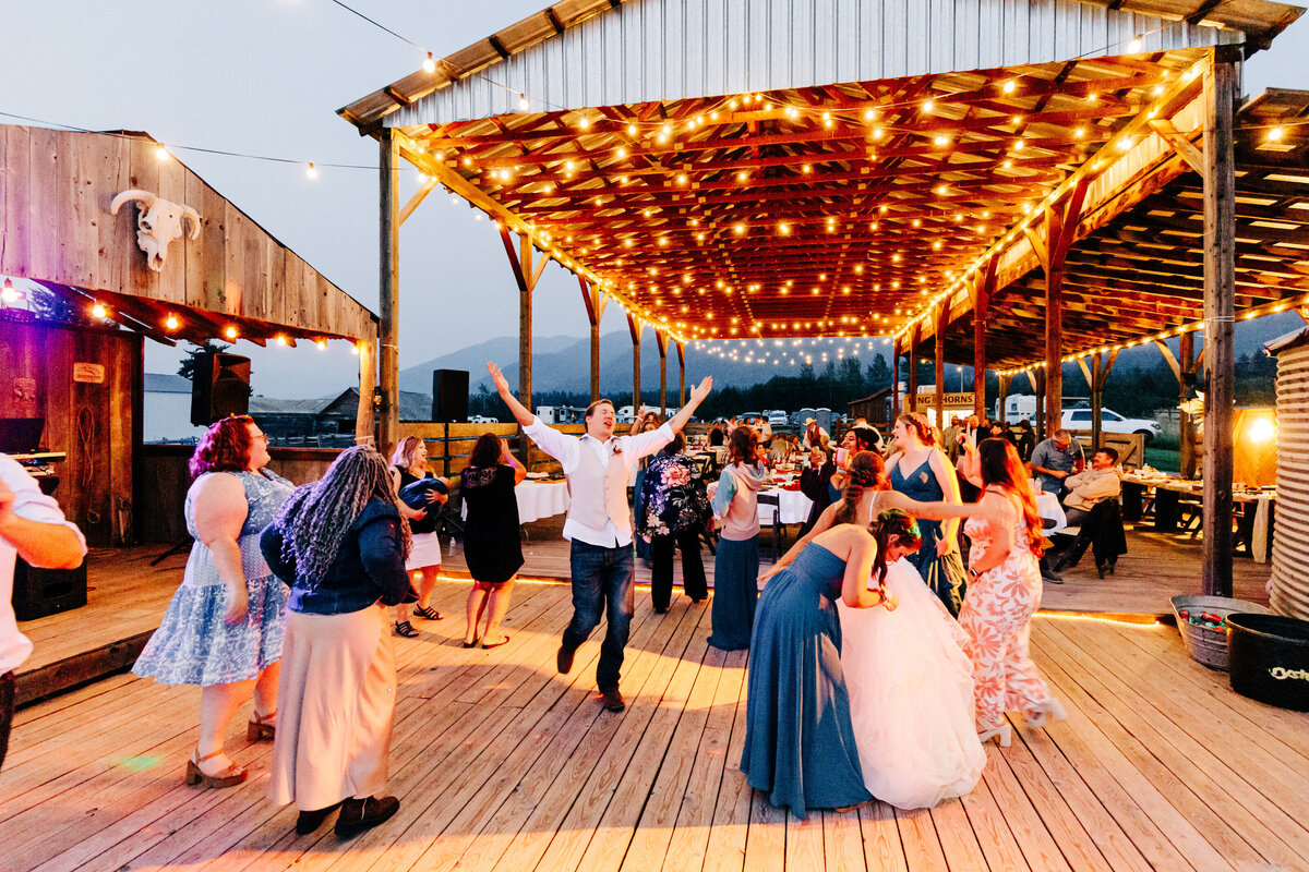 Guests at evening wedding reception at Cattle Springs in Arlee, MT