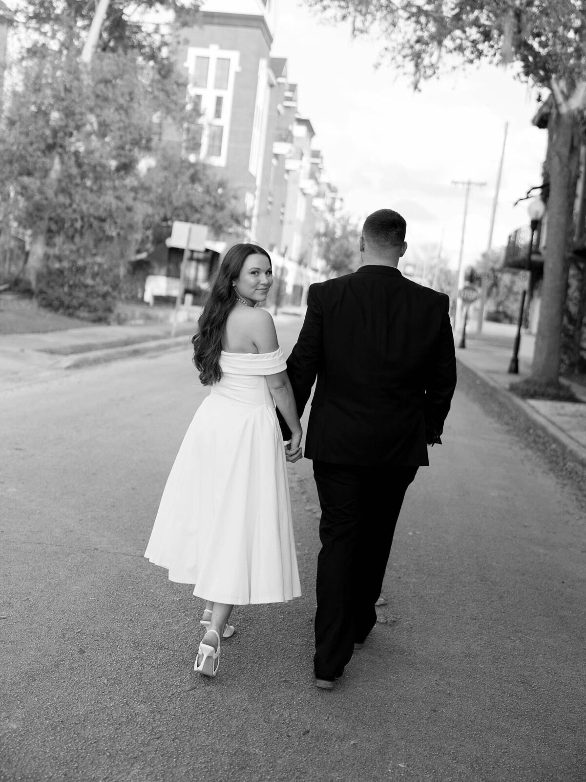 In town engagement photography in orlando with couple walking