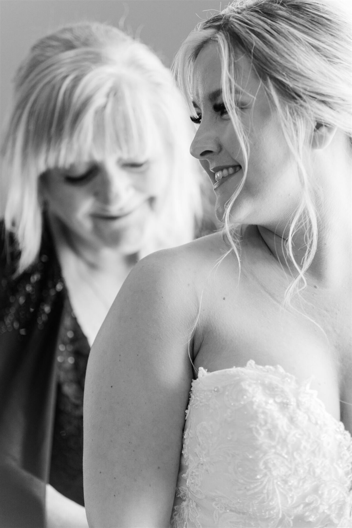 Mom helps her daughter get ready on her wedding day at The Lakes Resort in  Nova Scoita, Canada