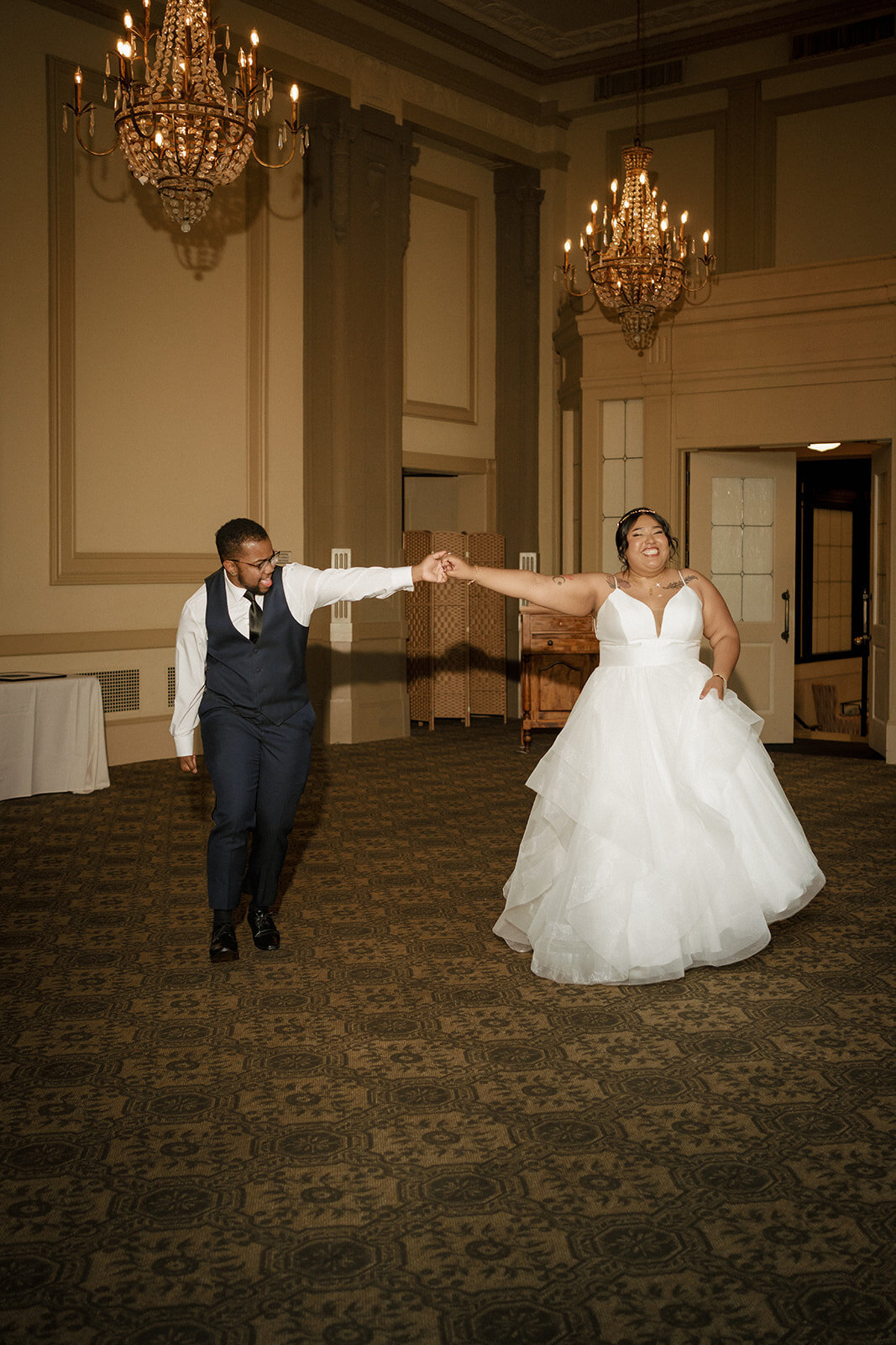 grand entrance wedding reception smiling couple