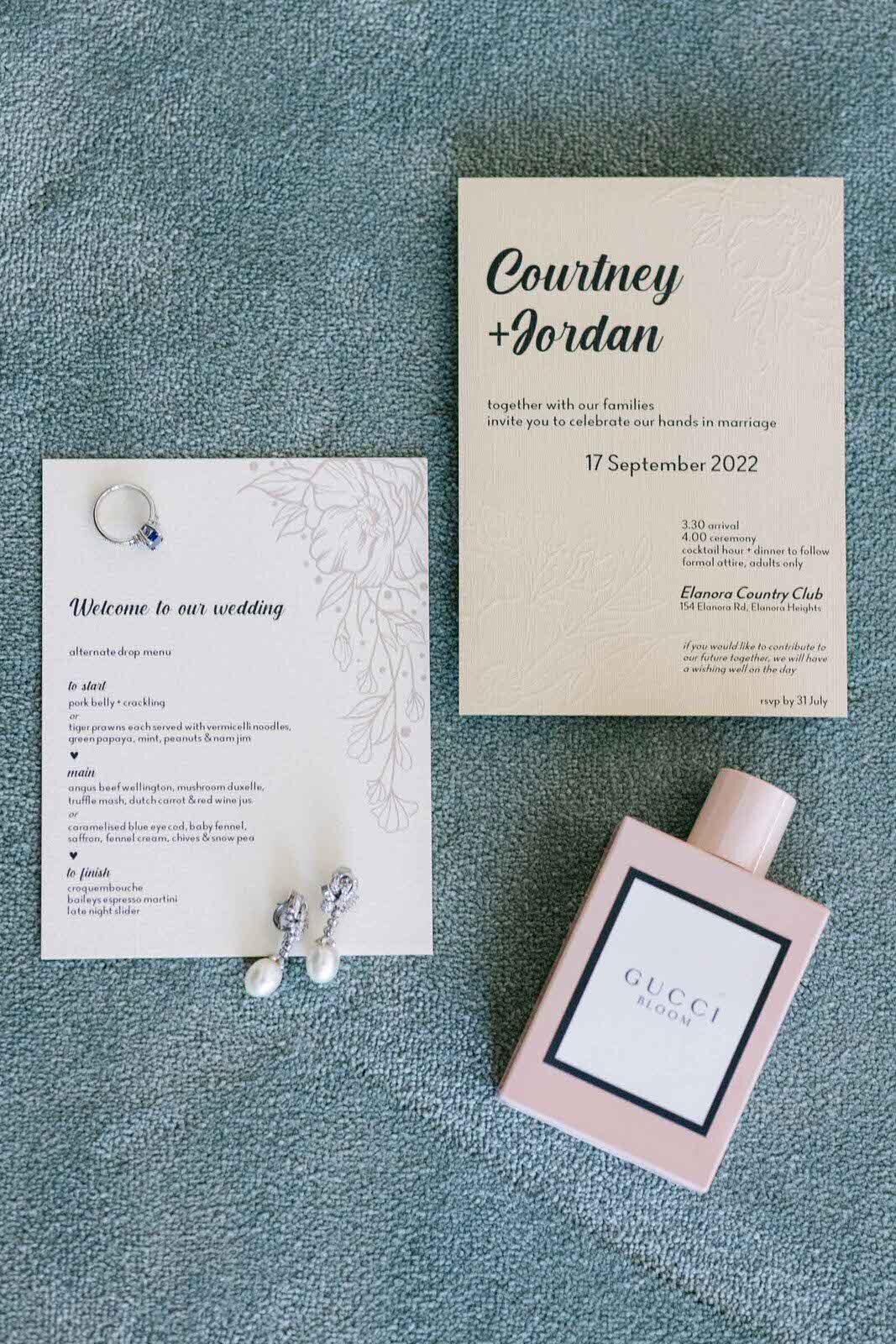 wedding invitation, bride's jewelries and perfume