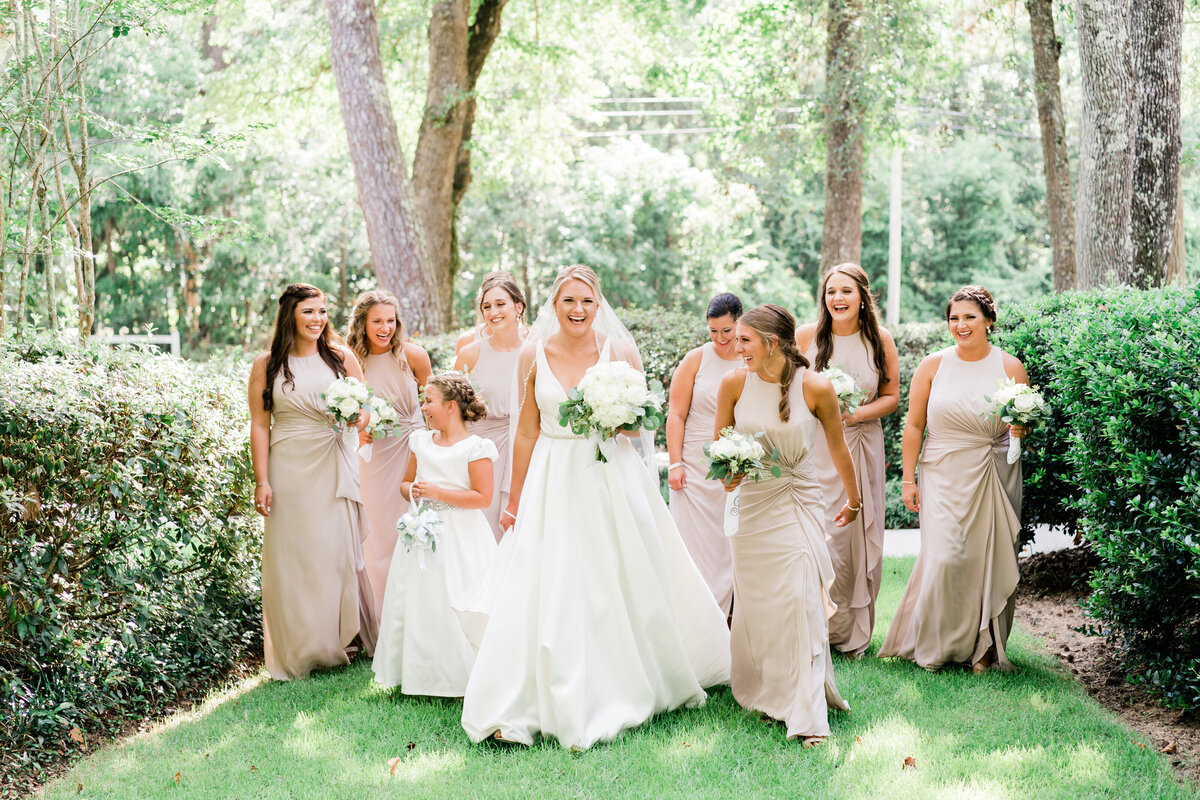 Bride with bridesmaids in tan dresses