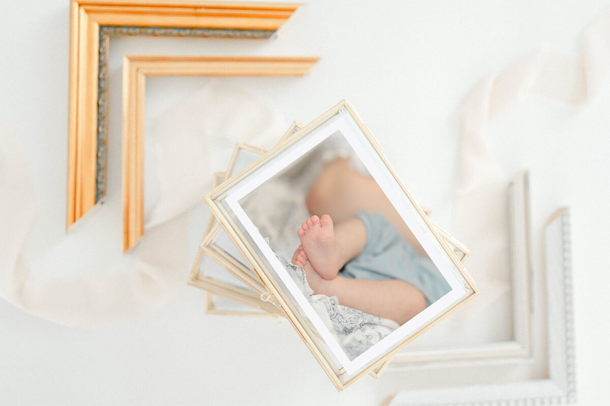 baby feet on a printed photo