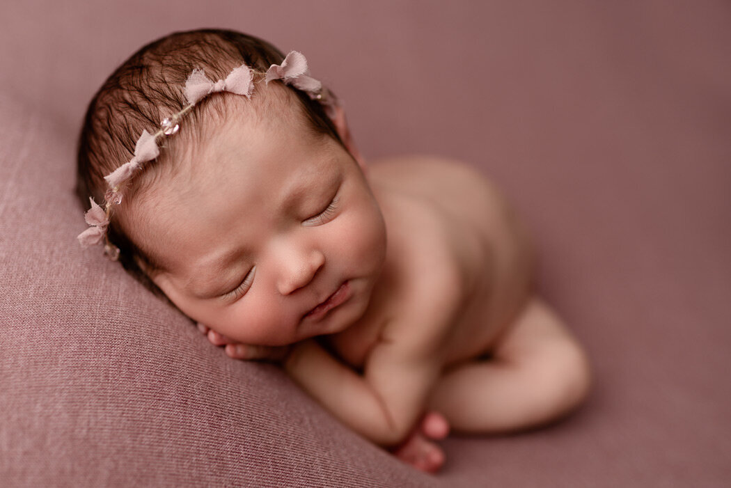 Brighton Newborn Photographer baby laying on hands by For The Love Of Photography