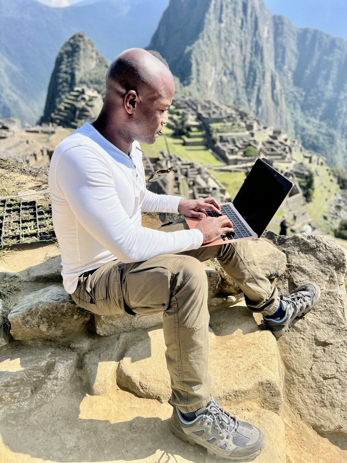 Kendis Gibson writing on a rock