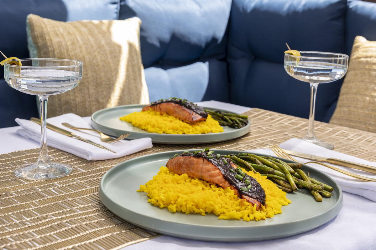 pan seared hot honey salmon served on saffron rice with a balsamic glaze.