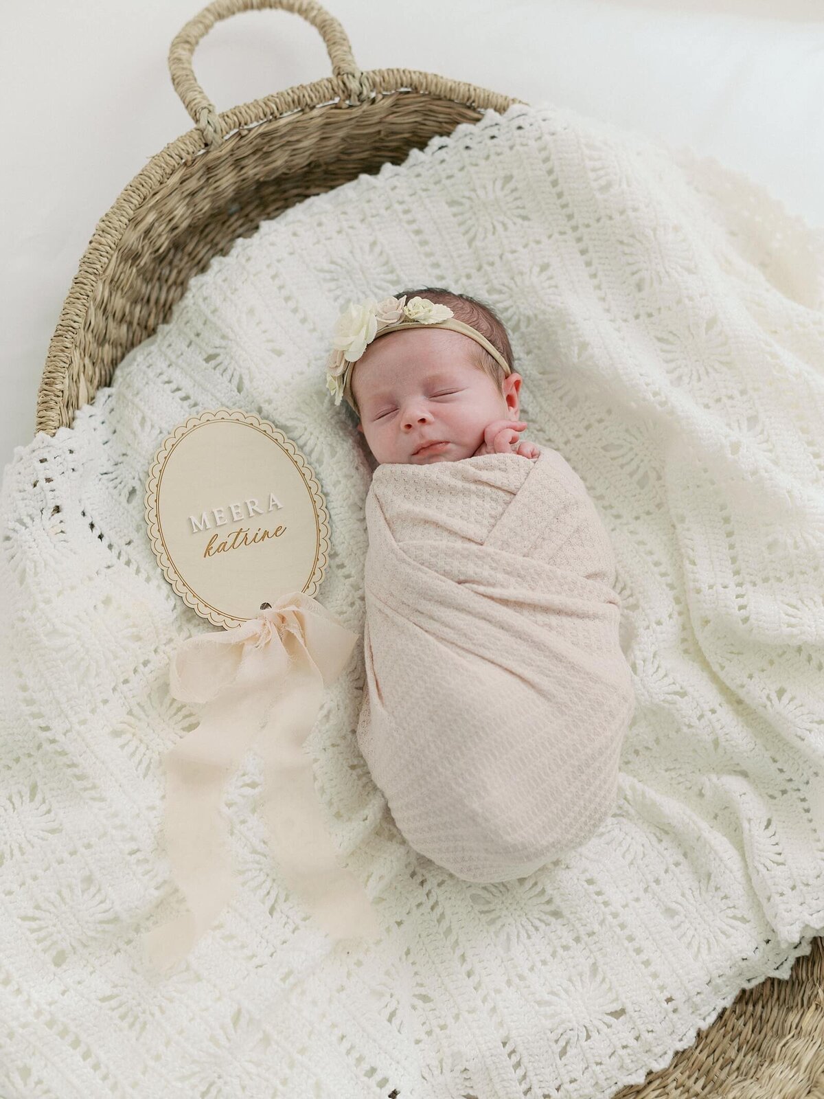newborn baby swaddled sleeps on baby blanket and basket with seattle newborn photographer Jacqueline Benét 