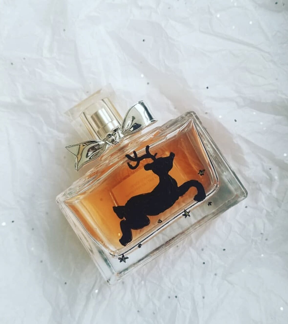Bottle painting for Dior holiday brand activation. Luxury fragrance with hand-painted reindeer design by Toronto live artist Jenny Zhang
