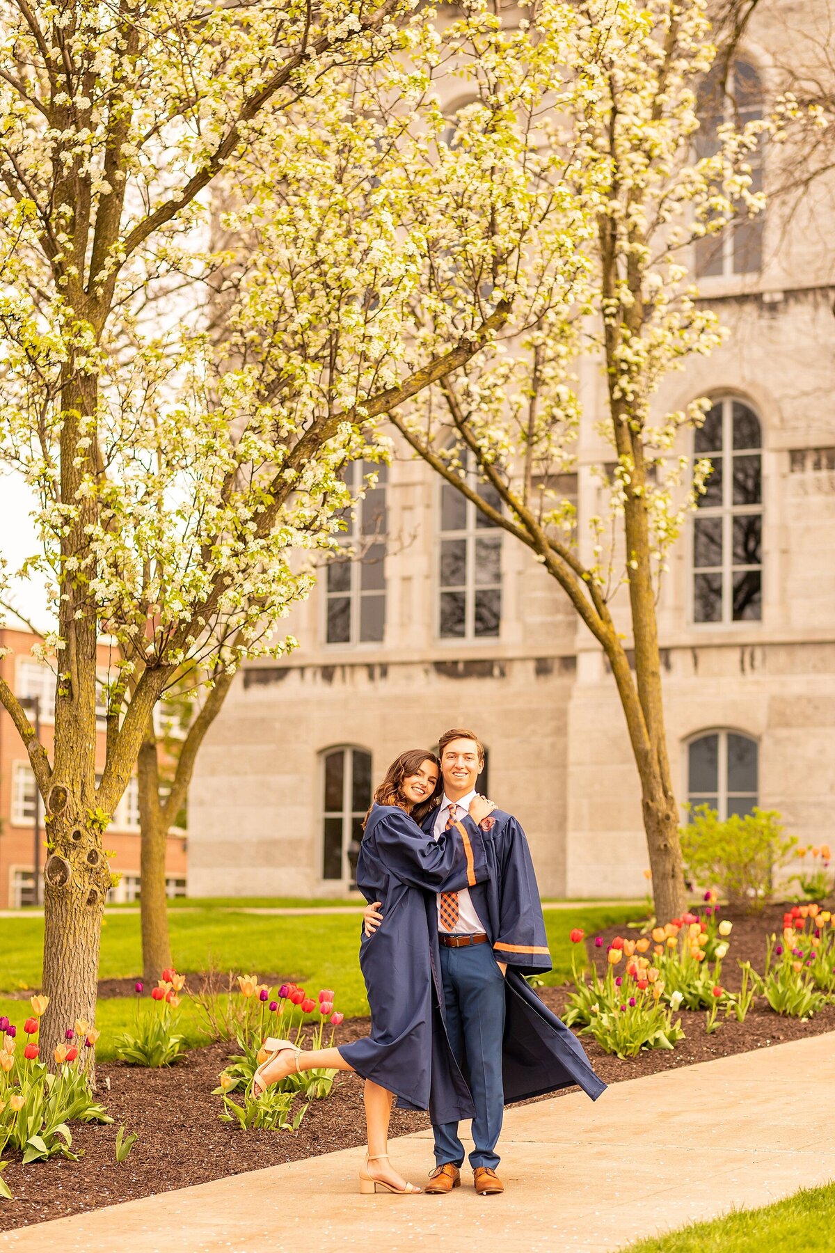 College graduates enjoying a Charleston portrait session celebrating academic success with timeless imagery