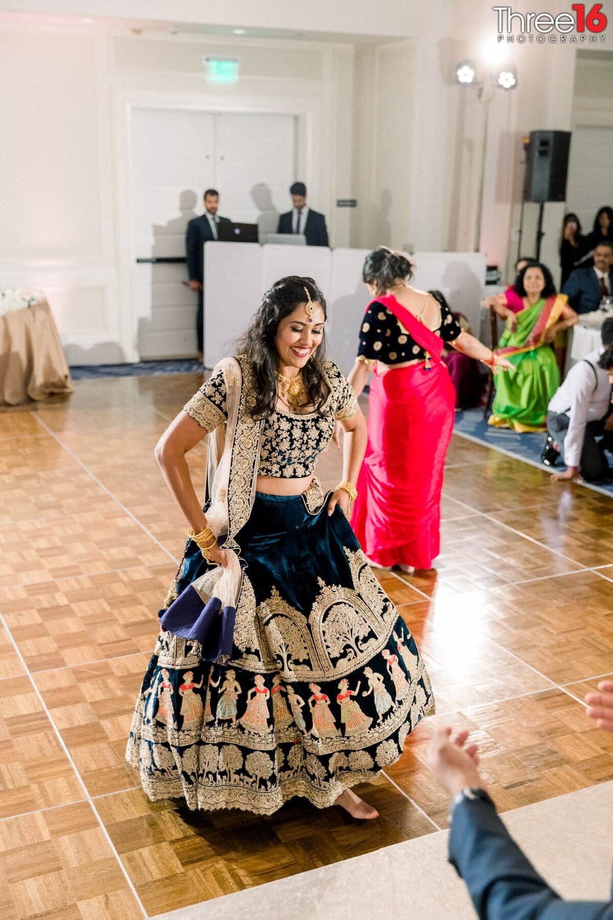 Indian Bride dances in front of her Groom