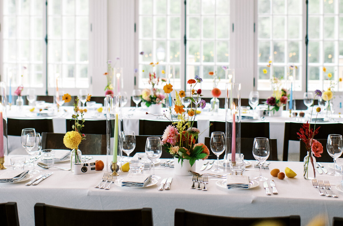 Tables at the Willow Inn topped with colourful floral centrepieces for a wedding reception.