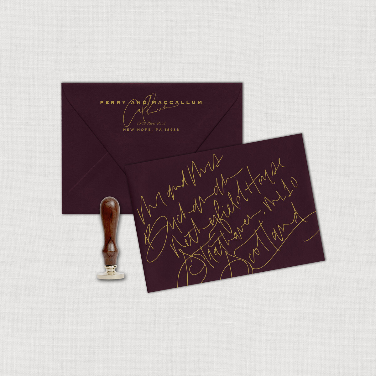 Scottish Wedding elopement burgundy mailing envelope with gold calligraphy.