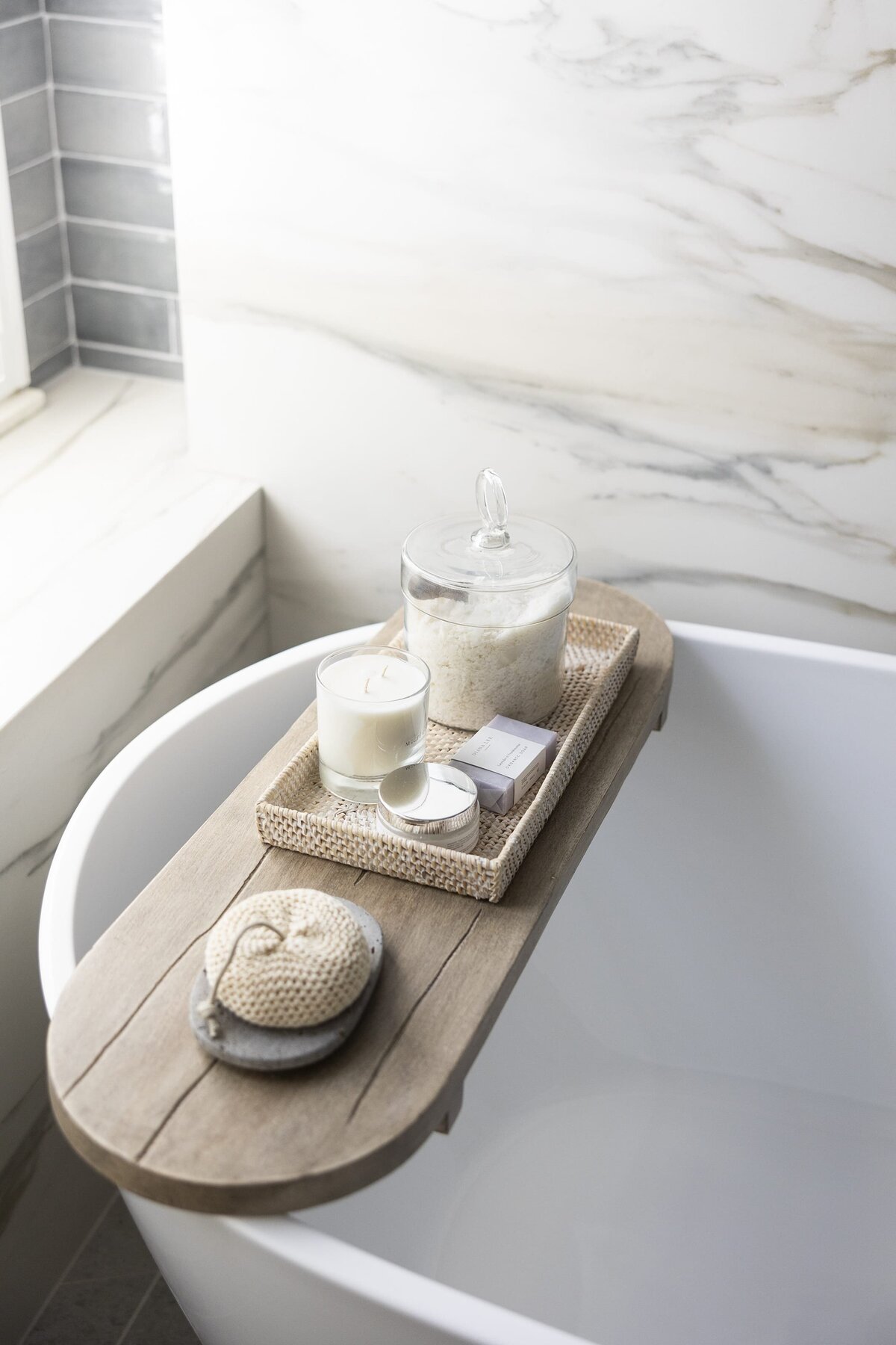 dewine design orlando interior designer contemporary coastal primary bathroom wooden tub table with candle