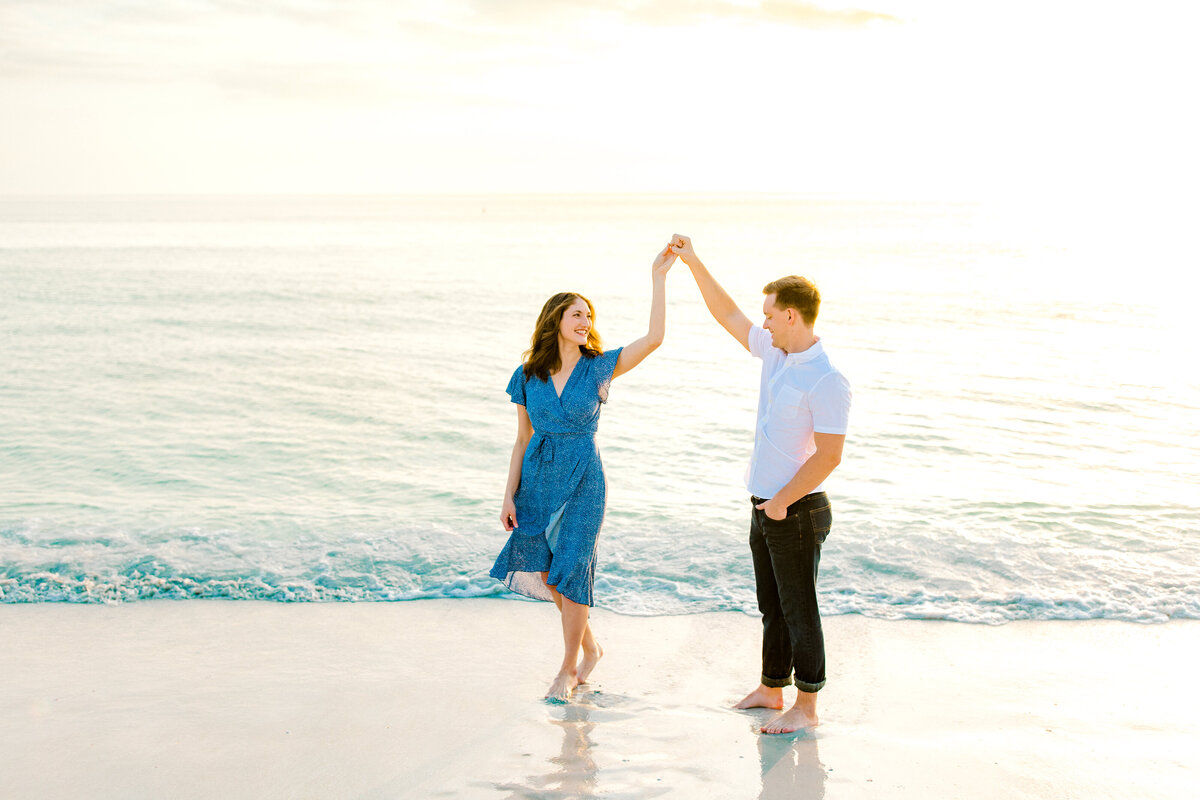engaged couple for photos at lido key beach in florida