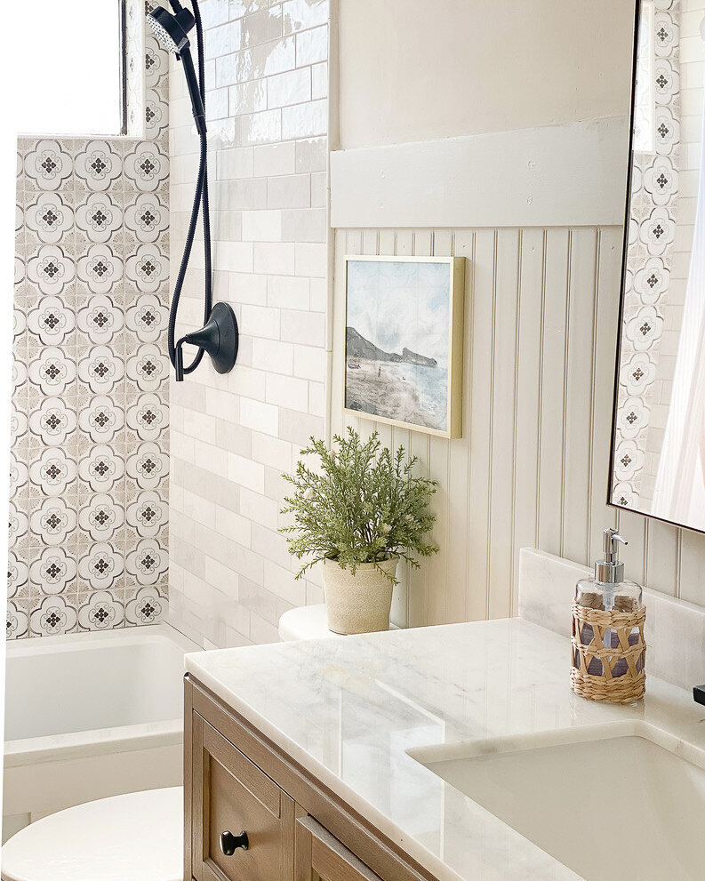 Light and airy bathroom with wood vanity, shiplap, pattern and zellige tile