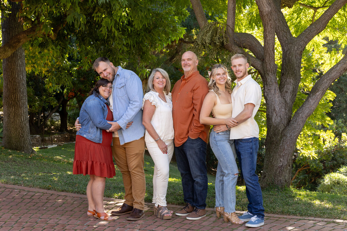 Family hugging  wearing fall colors