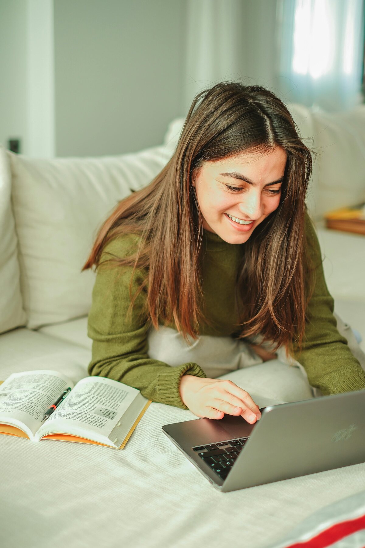girl on computer with bible