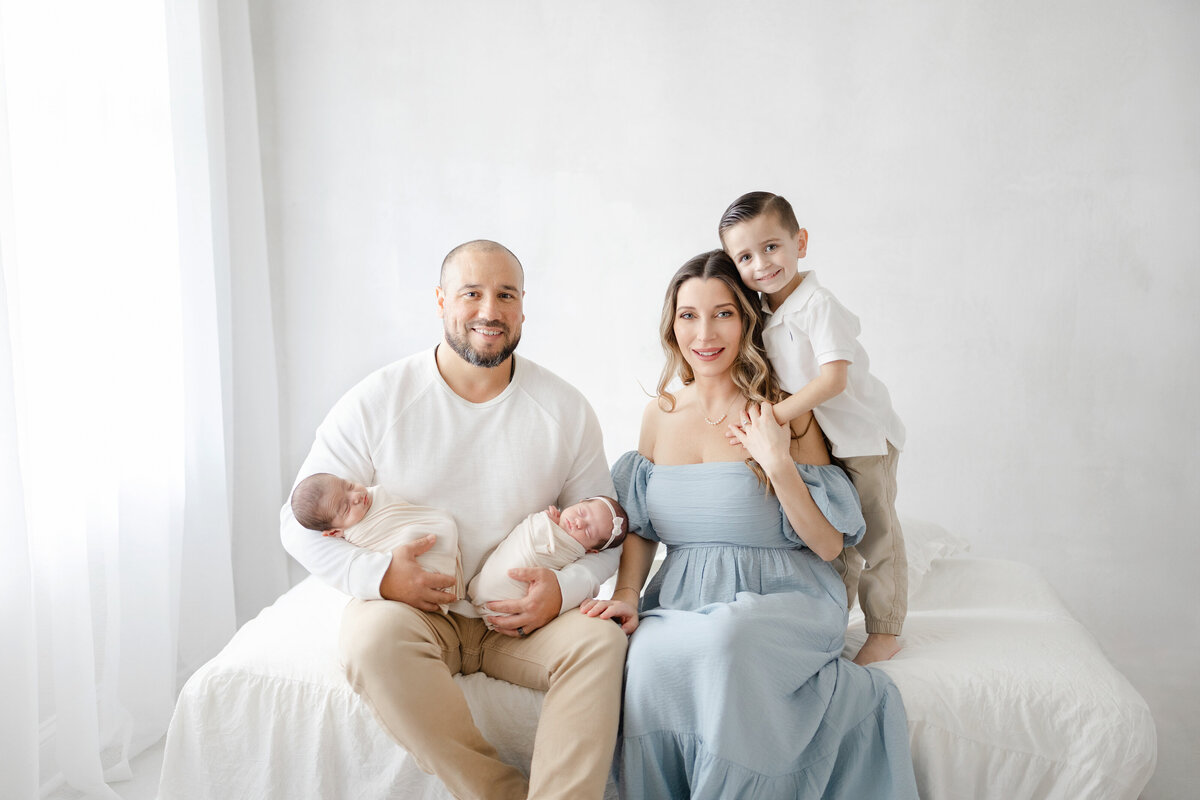 Luxury Tampa newborn portrait in natural light studio with soft neutral tones