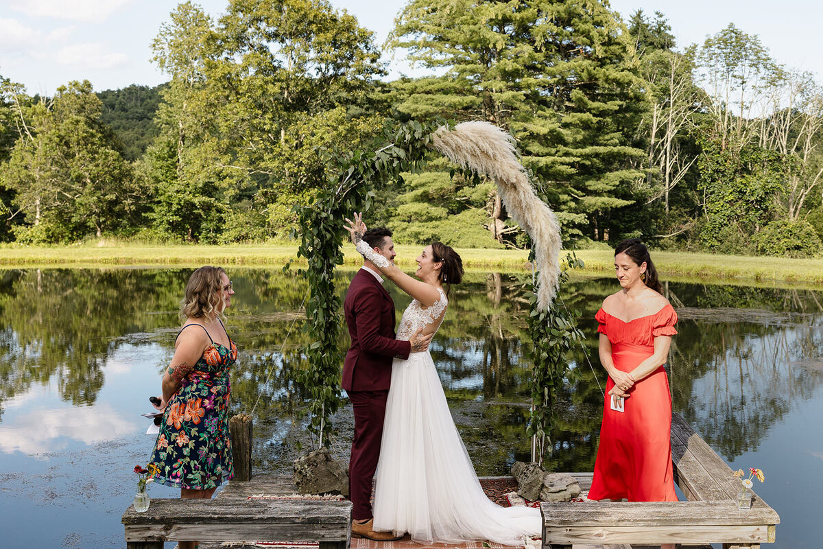 A couple hugging as they lean in for their first kiss
