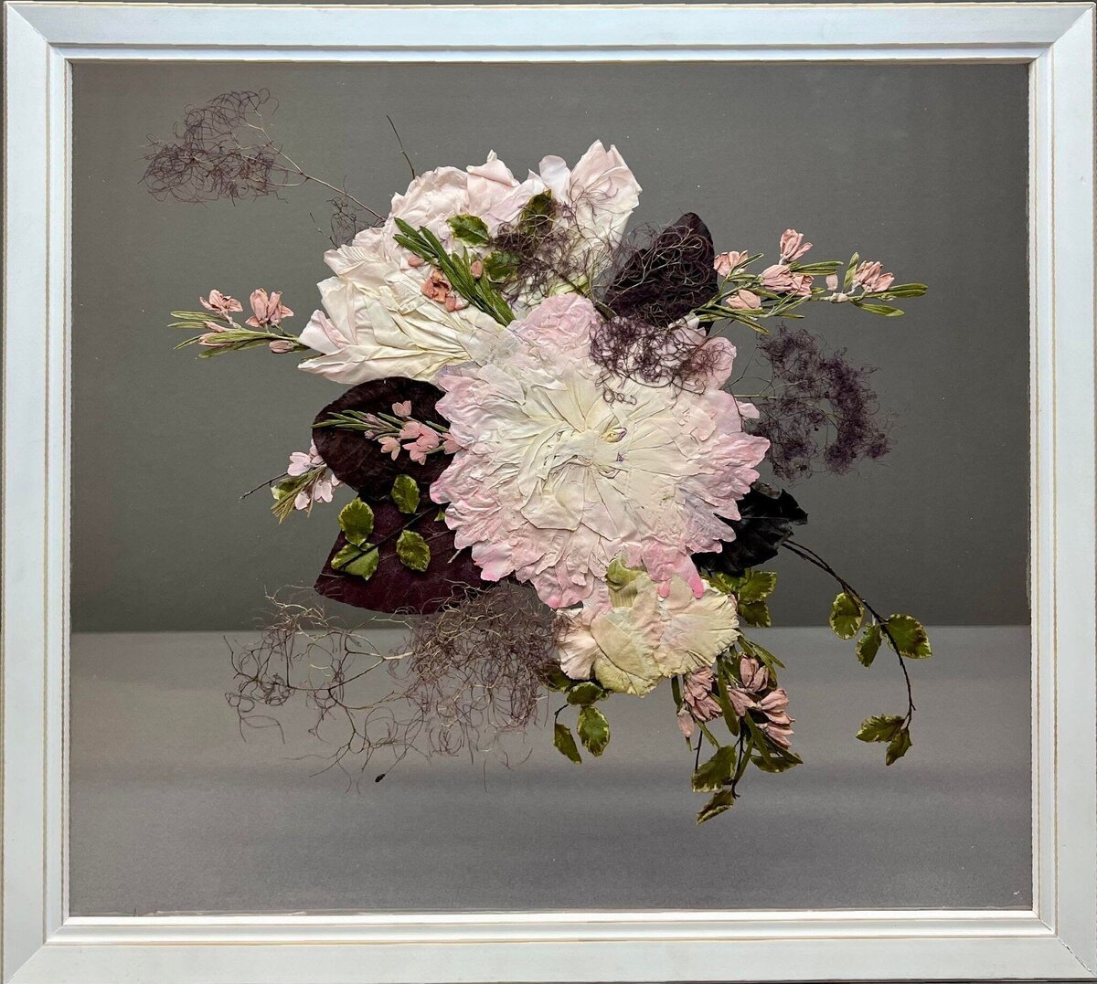Pressed florals in glass frame.