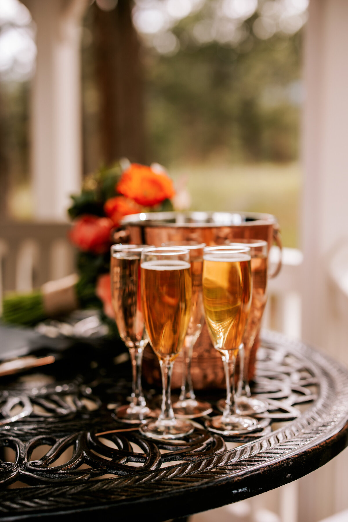 Champagne glasses full and waiting for the newlyweds to make a toast while signing their marriage certificate