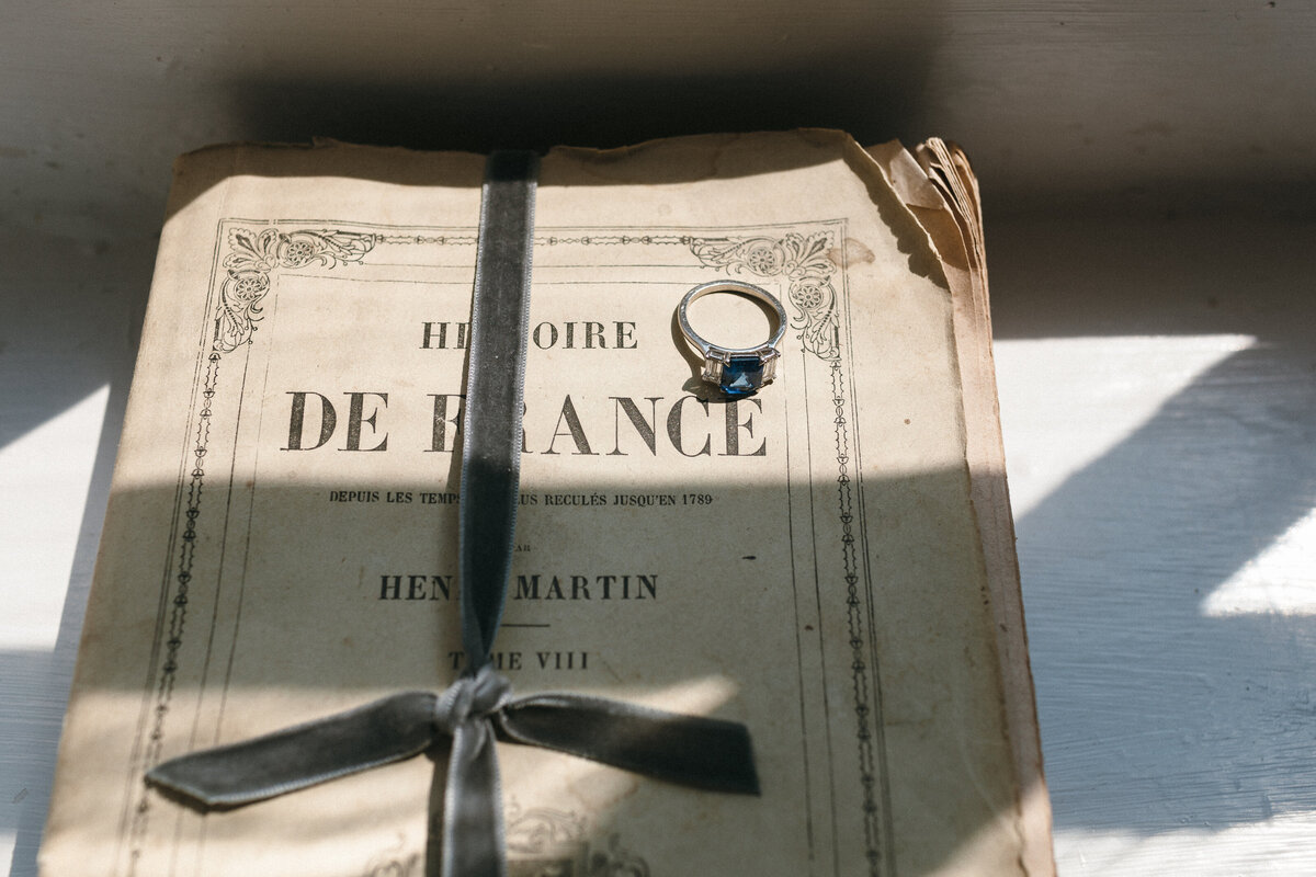 Sapphire Engagement ring on antique papers 