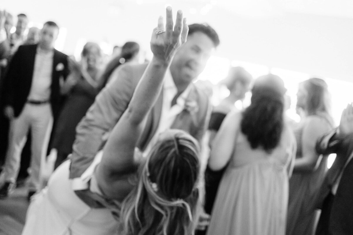 Bride and groom dancing in black and white