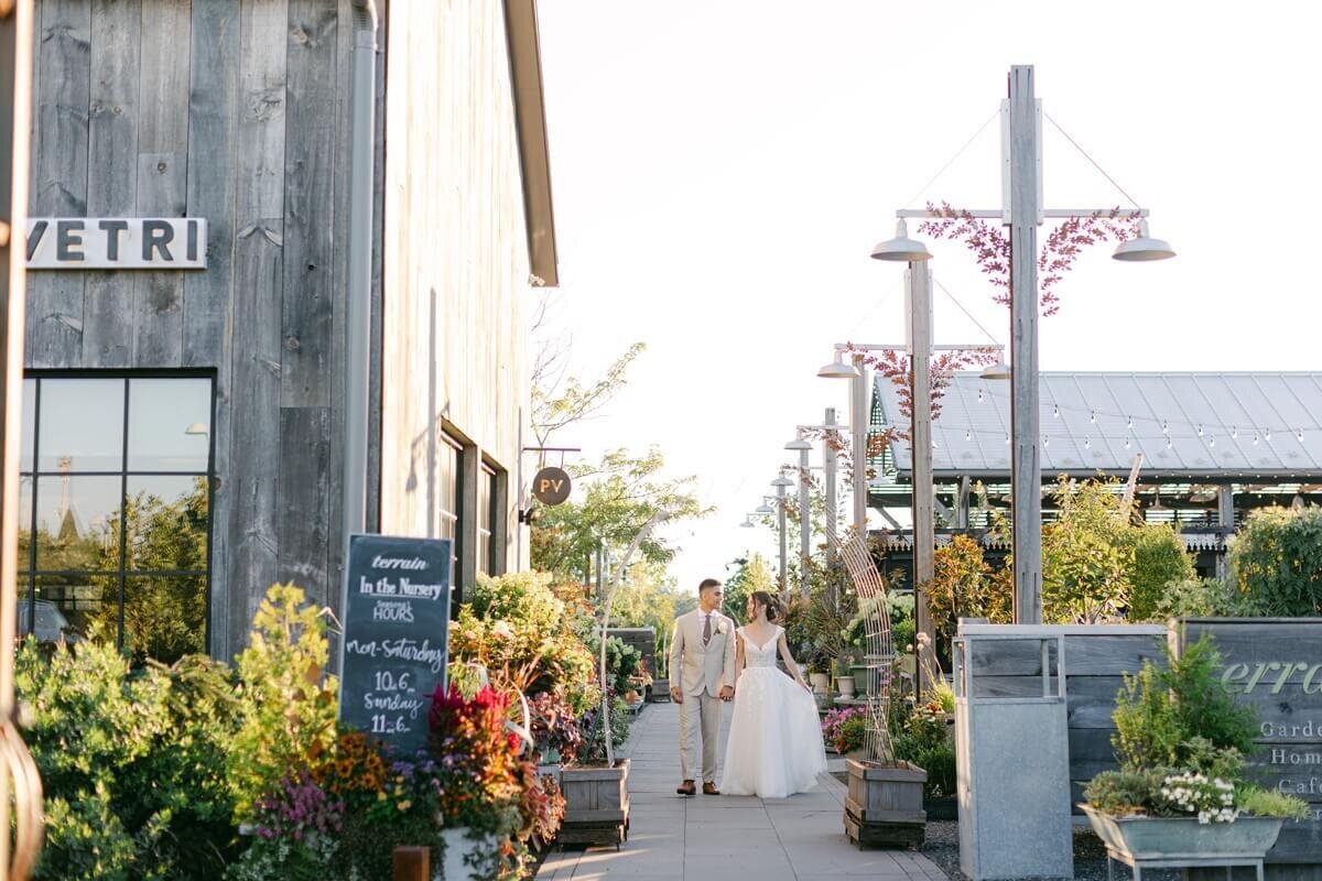 bride and groom walking through terrain gardens