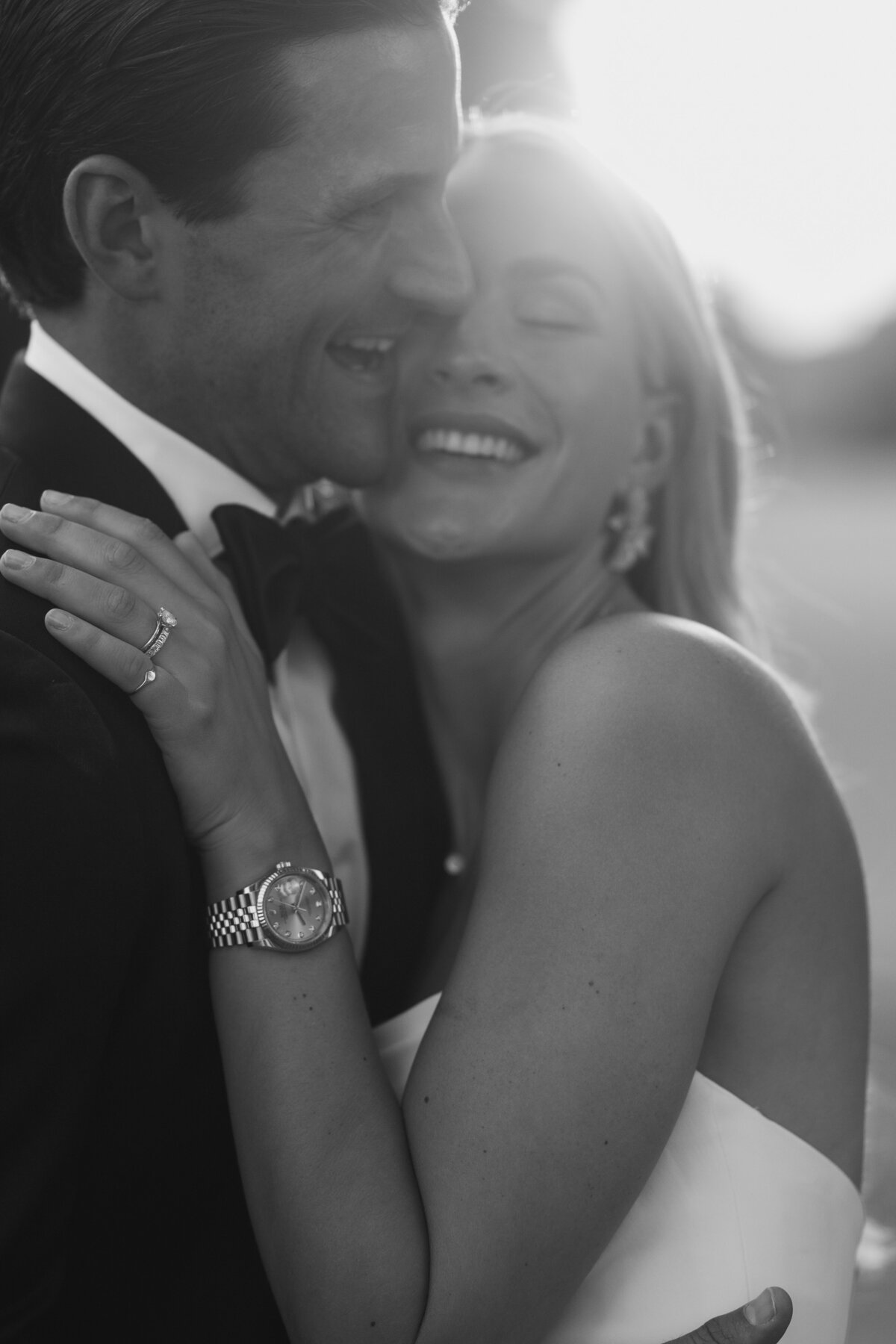 Gorgeous couple embracing at sunset black and white