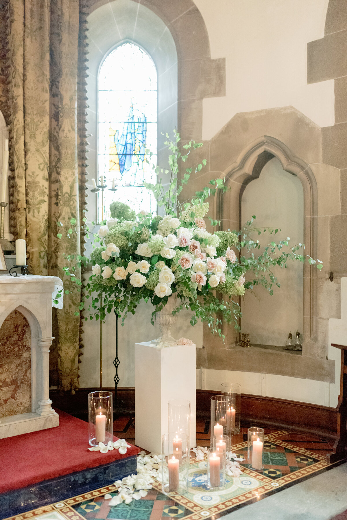 Cromlix House Chapel ivory and coral floral display by Lavender and Rose Events, chapel wedding in Cromlix House Scotland.