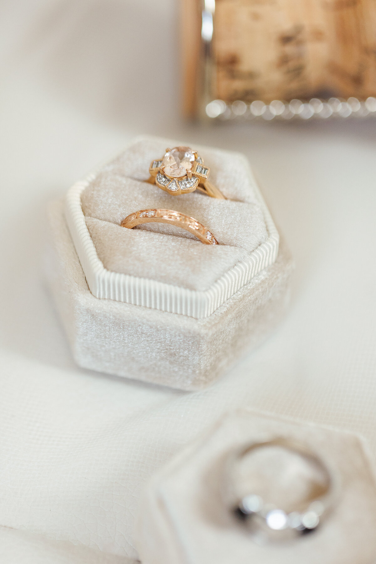 Gold wedding rings displayed in velvet hexagon ring box at Brendan and Sara’s Fetewell wedding in Baltimore.