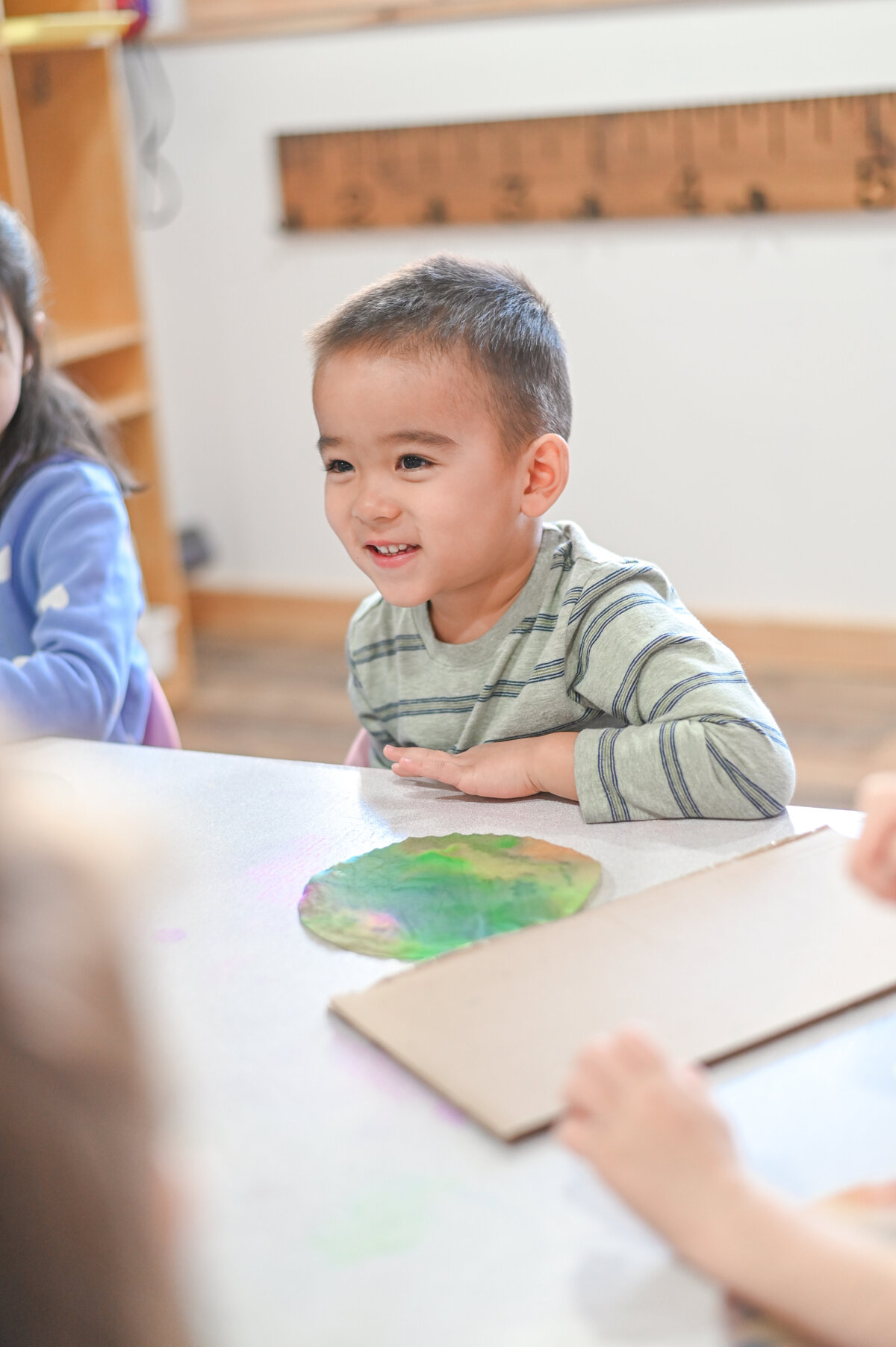 Student working on turtle craft at House of Parker Preschool Gorham Maine