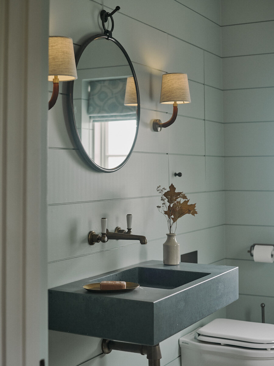 Custom marble sink in bespoke home powder room