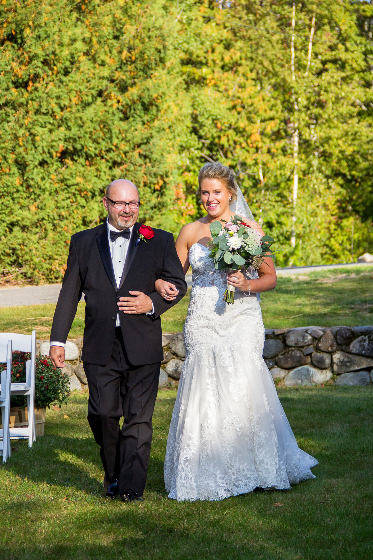Bride walking down the aisle with man | Taken by Maine Wedding Photographer
