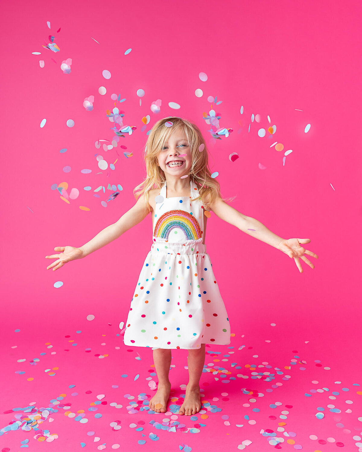 girl playing with confetti