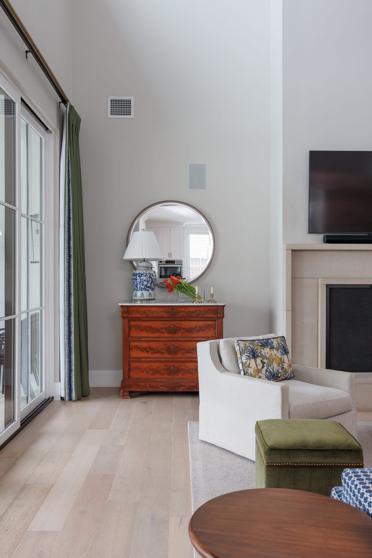 the keeping room interiors primera living room wooden table with lamp and round mirror