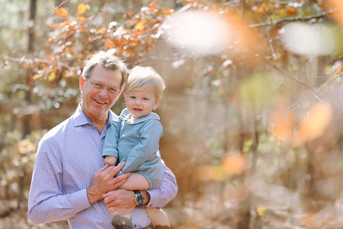 granddad-and-toddler-under-tree