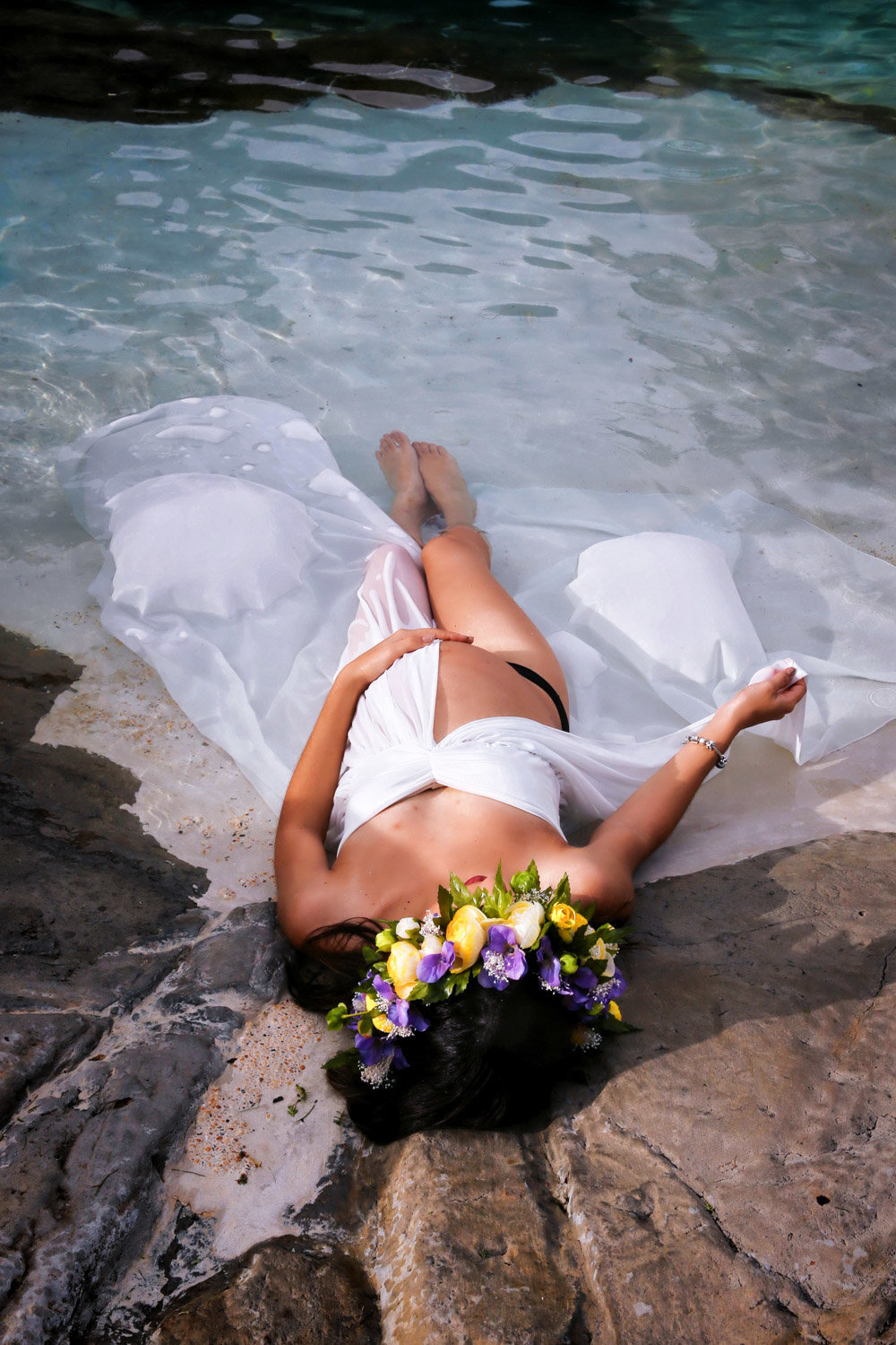 Glamourous pregnancy shot of mom-to-be lying on the beach. Photo by Ross Photography, Trinidad, W.I..