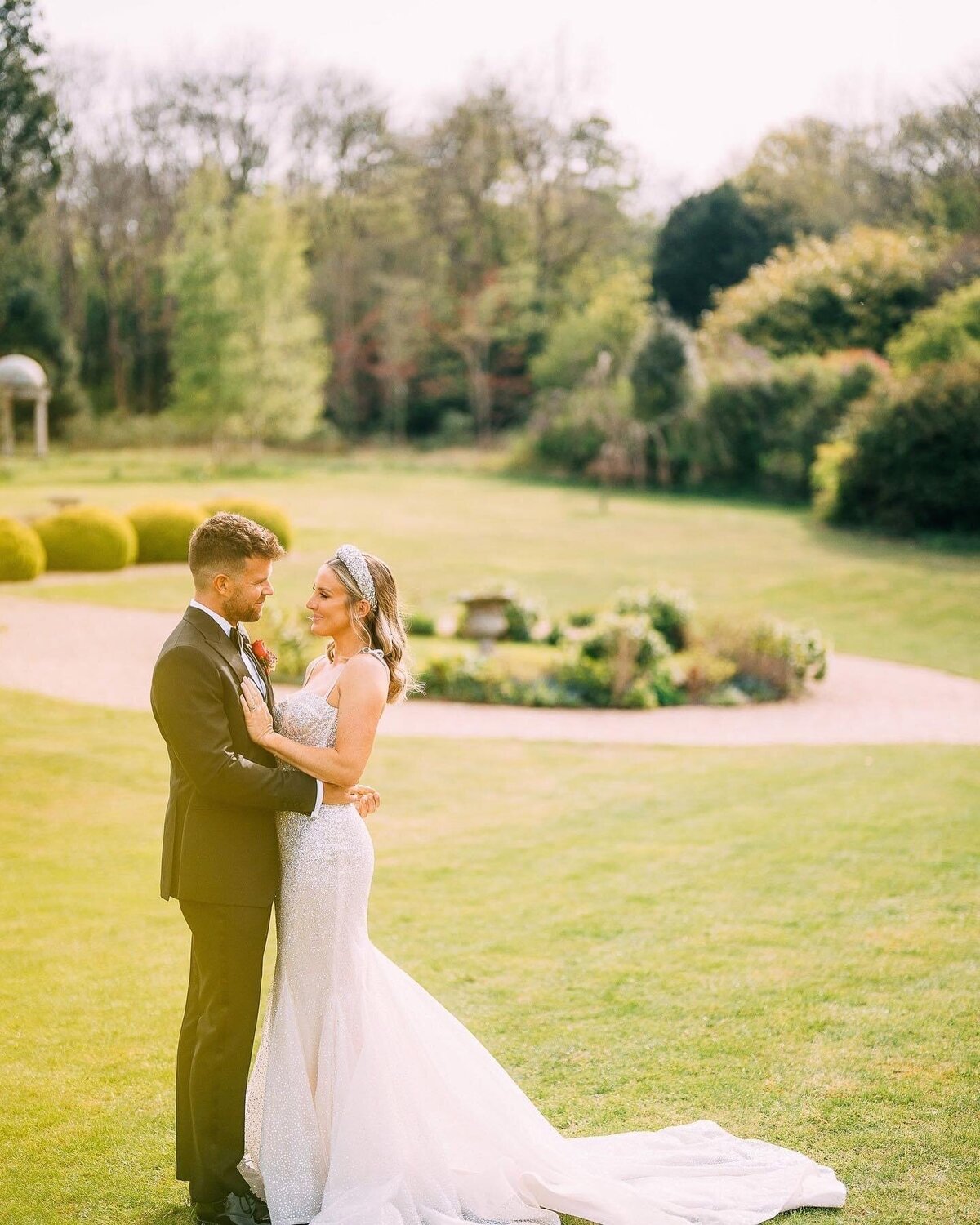 Bride and groom portraits on green outdoor lawn