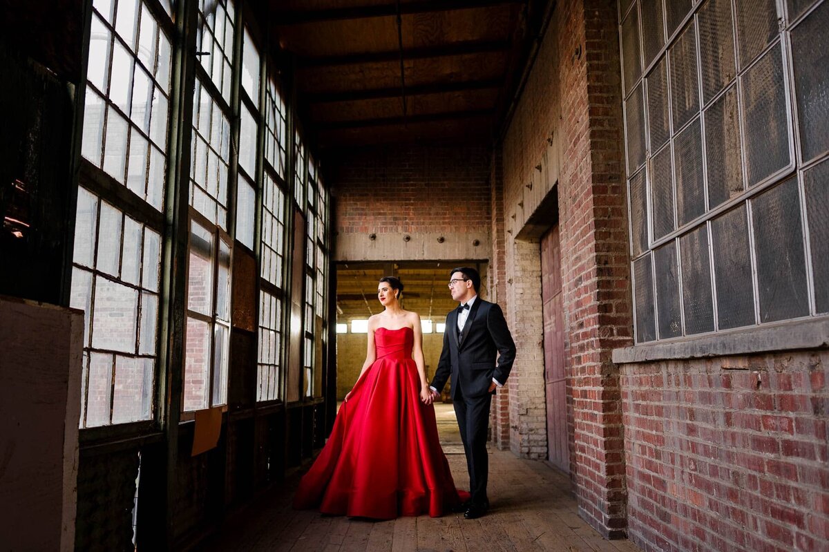 bride with red dress at epic railyard venue In el paso texas