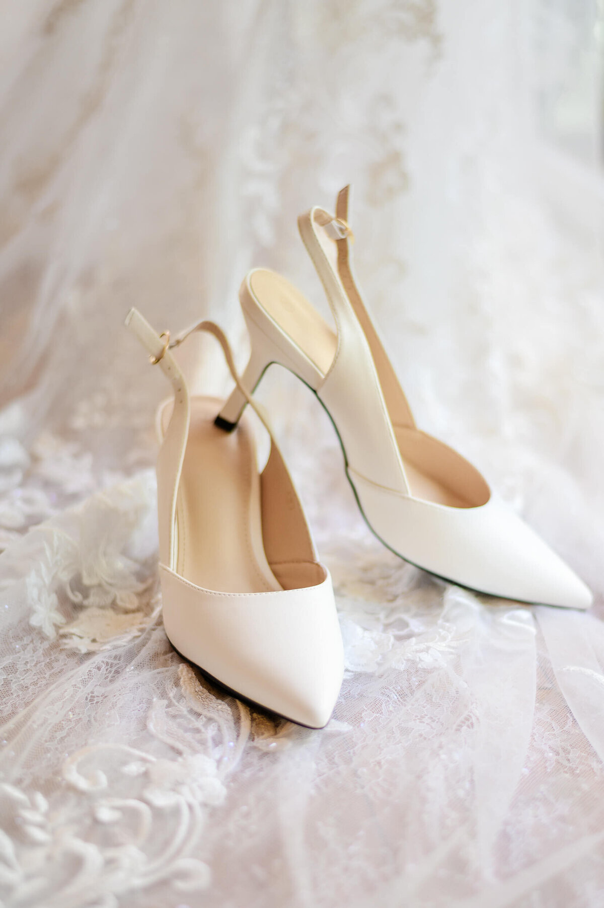 Elegant bridal shoes styled on wedding dress train, captured by Pittsburgh wedding photographer Bree Stewart of LLP. 