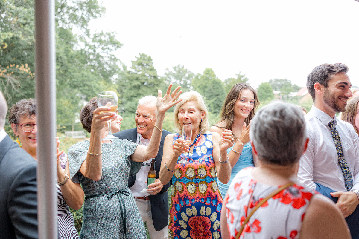 Wedding guests smiling and clapping