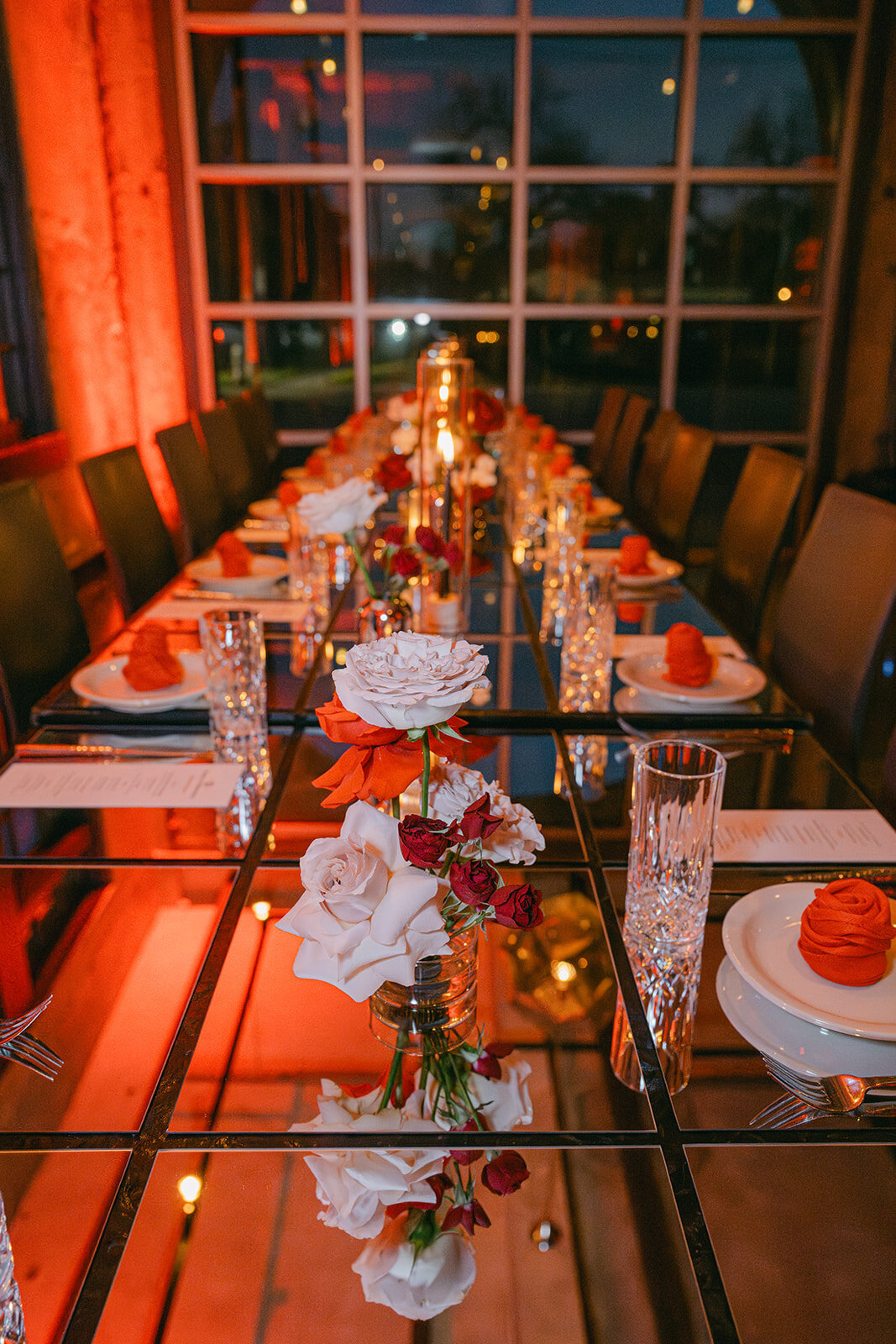 Fine art composition of reception layout with luxury flatware, candles, and florals in Texas venue