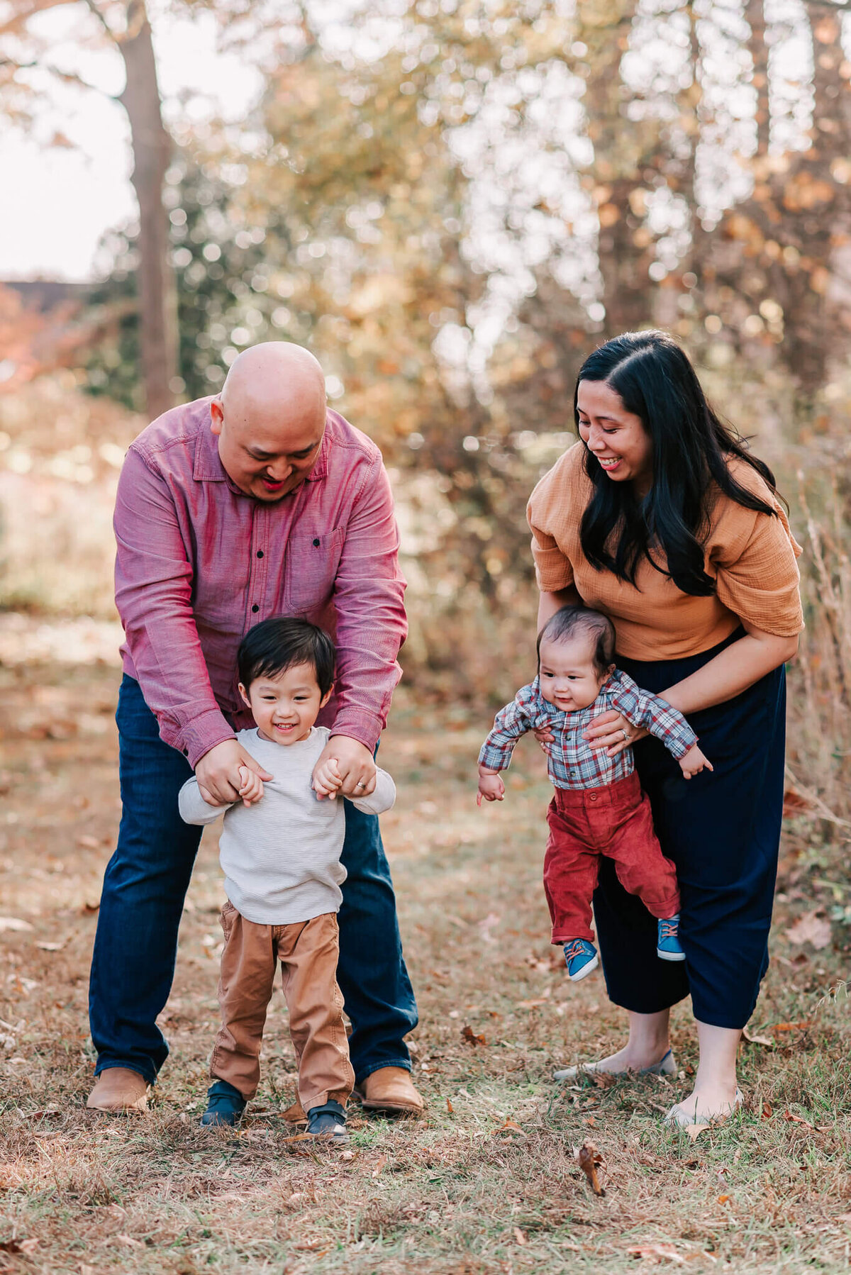 Parents interacting with their two kids during their family photography in Northern Virginia