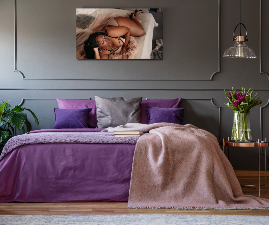 Purple bed in Minneapolis MN with a boudoir framed print above the bed