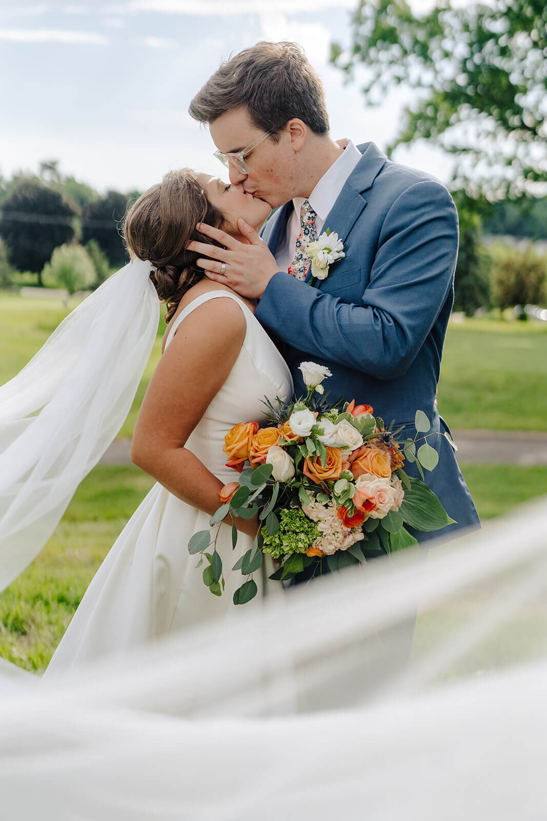 Bride and groom kissing at Oswego wedding, NY